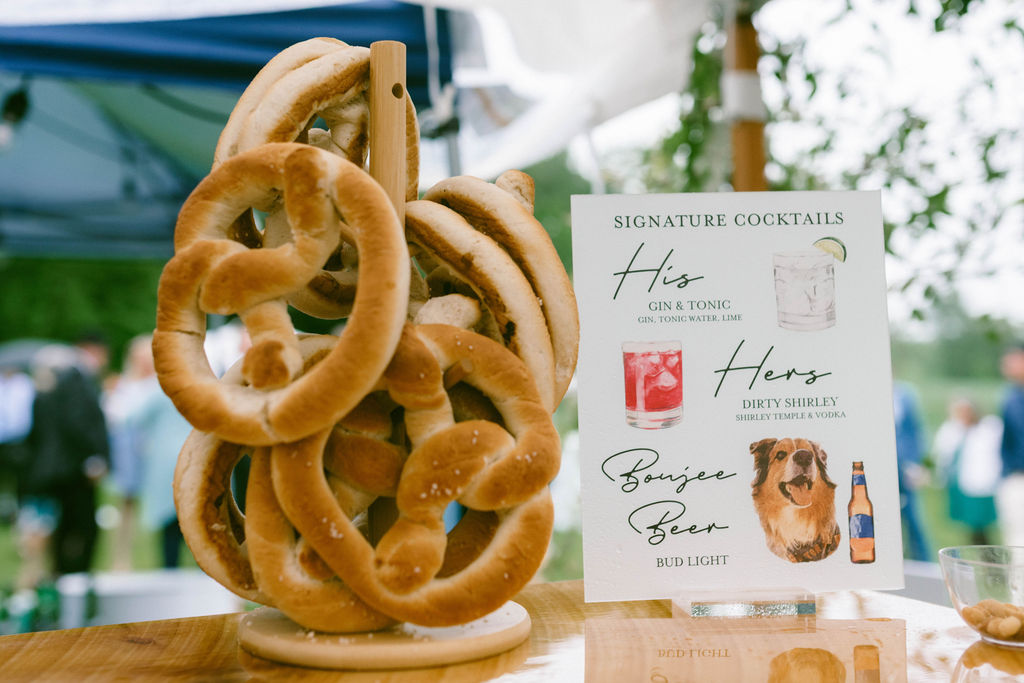 his & hers wedding drink sign with pretzels 
