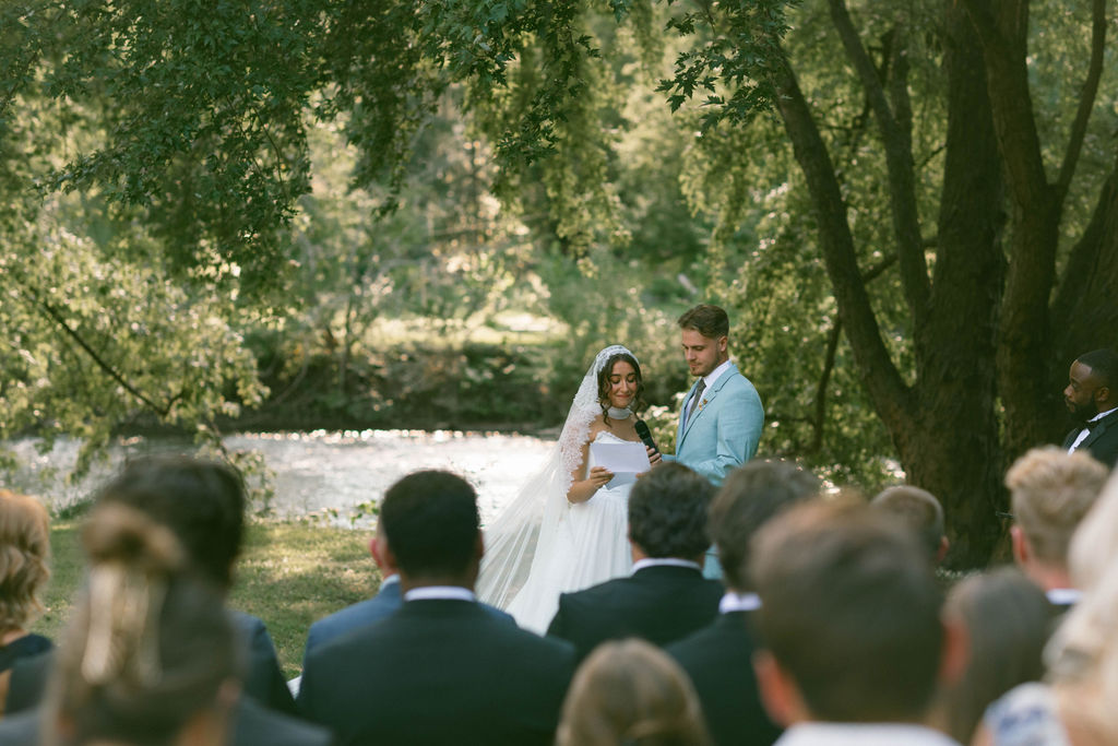 bride & groom ceremony at a jane austen inspired intimate backyard wedding