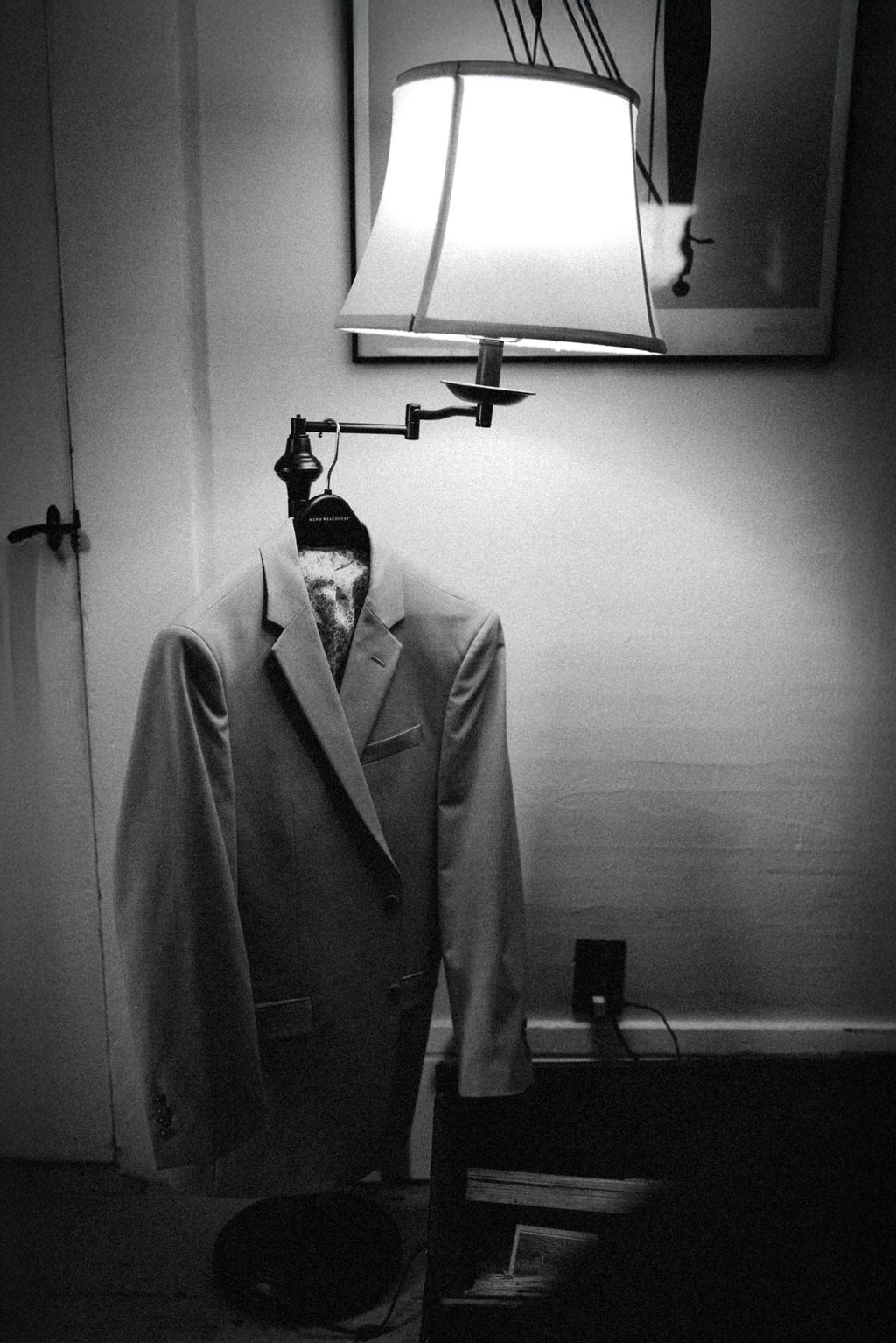 groom's jacket hanging on antique lamp Saddle Hill Farm wedding