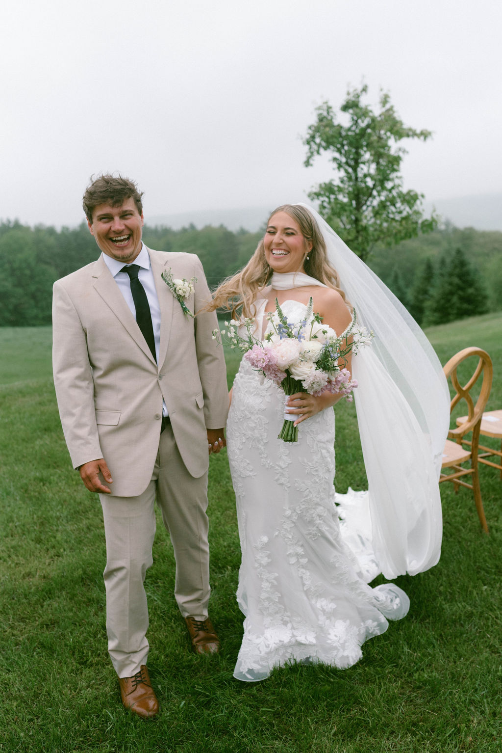 Bride & groom celebrating and laughing