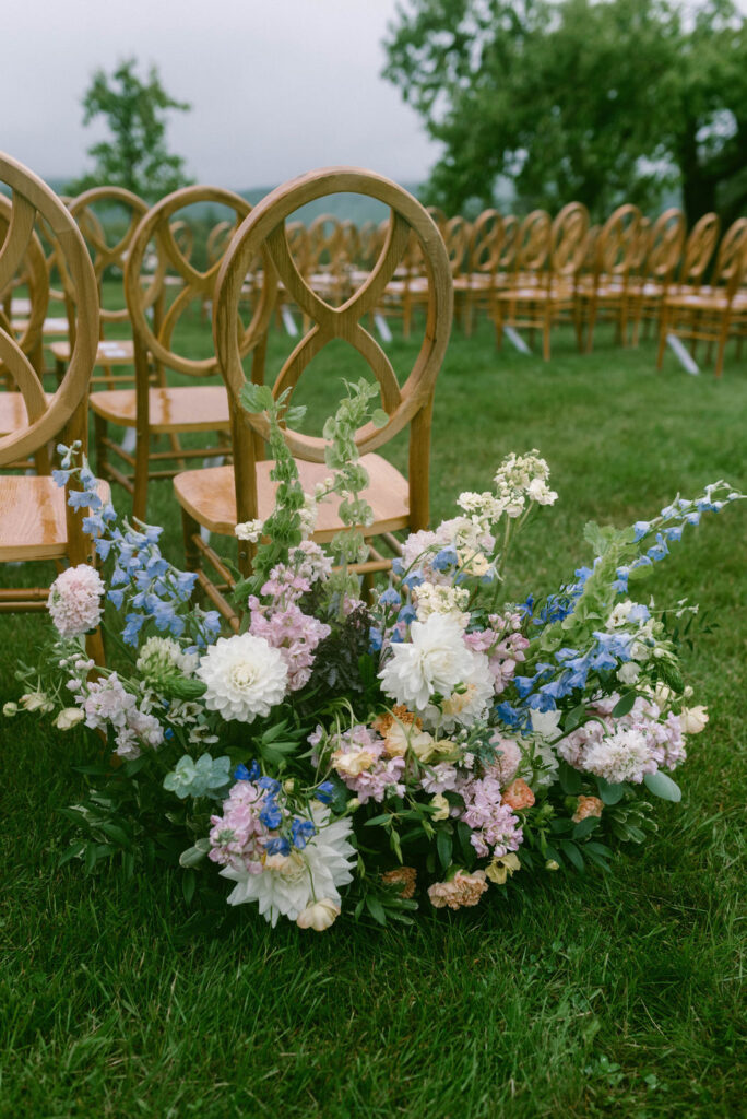 ceremony aisle with chairs and floral arrangements of hydrangeas 