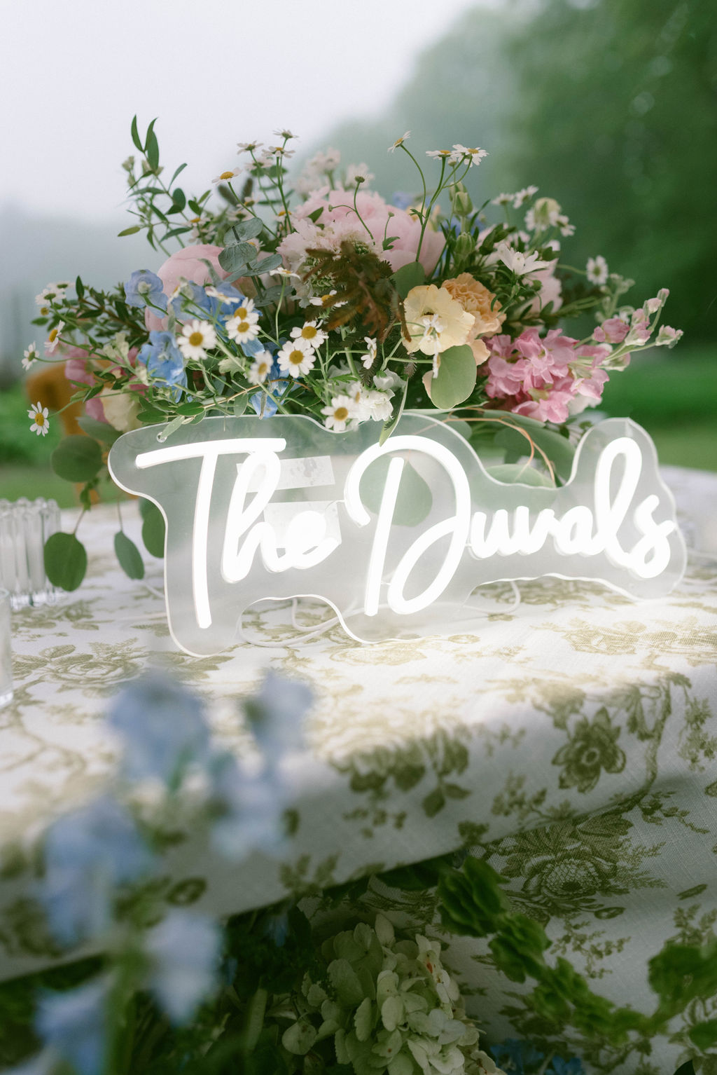 neon sign with bride and groom's last name 