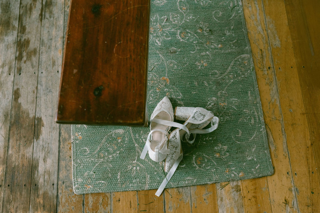 bride's shoes on a rug 