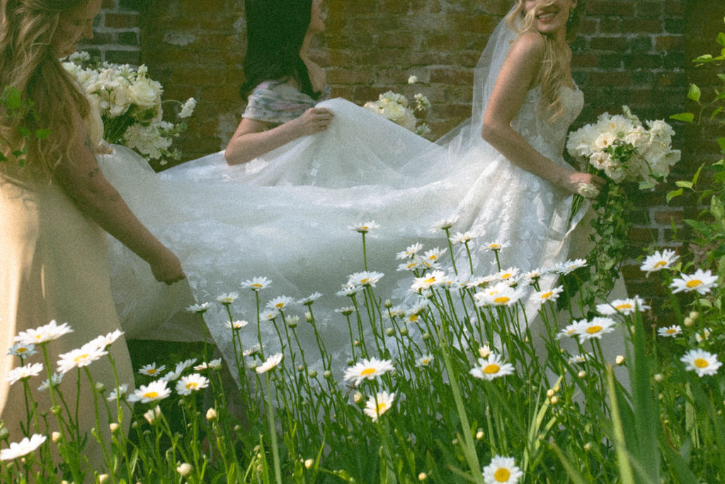 Romantic Connecticut garden wedding Bride & Bridesmaids walking in the garden
