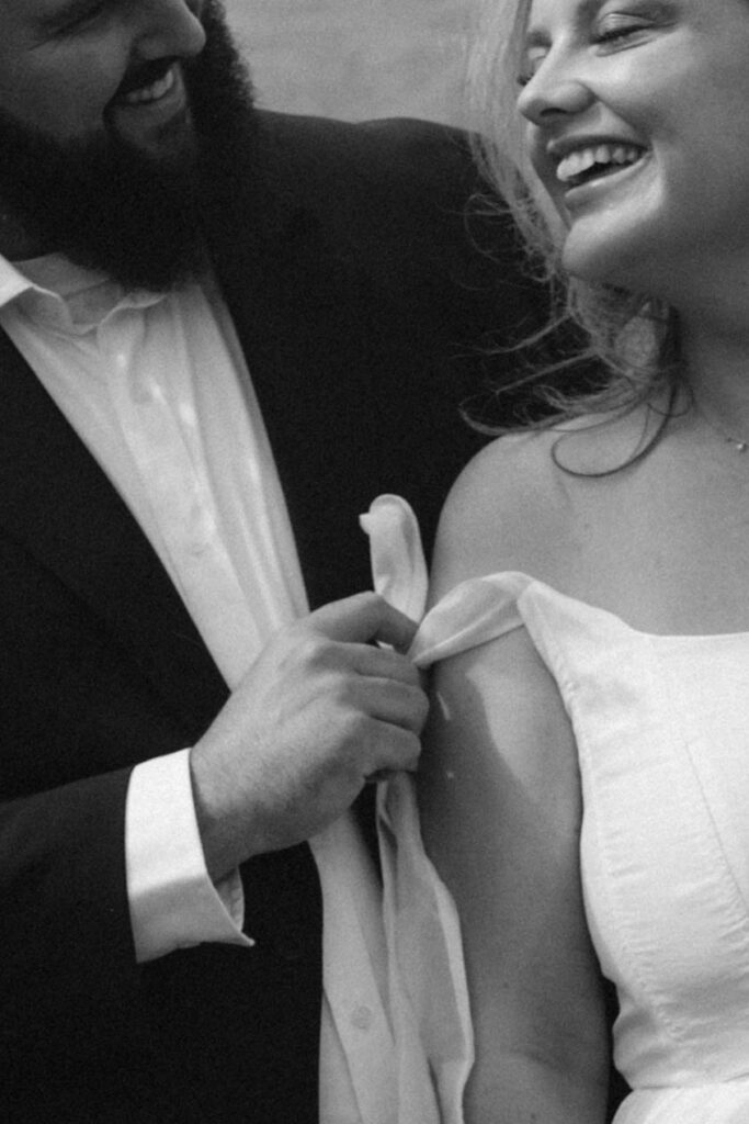 Your Dream Guide to a Smoky Mountain Elopement Bride & Groom in a field of wildflowers