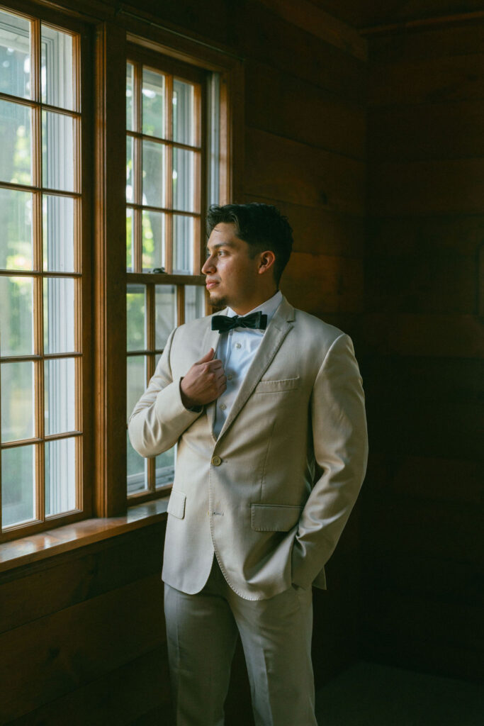 groom during his photoshoot at his romantic wedding day