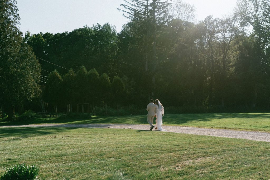 bride and groom walking to their reception