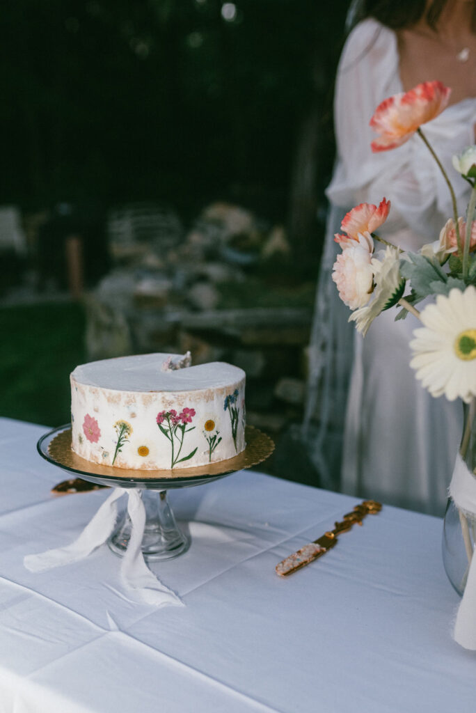 floral cake at wedding reception 