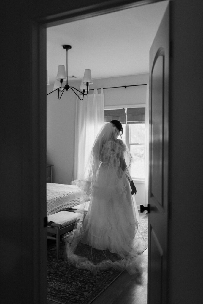 bride in wedding dress in doorway