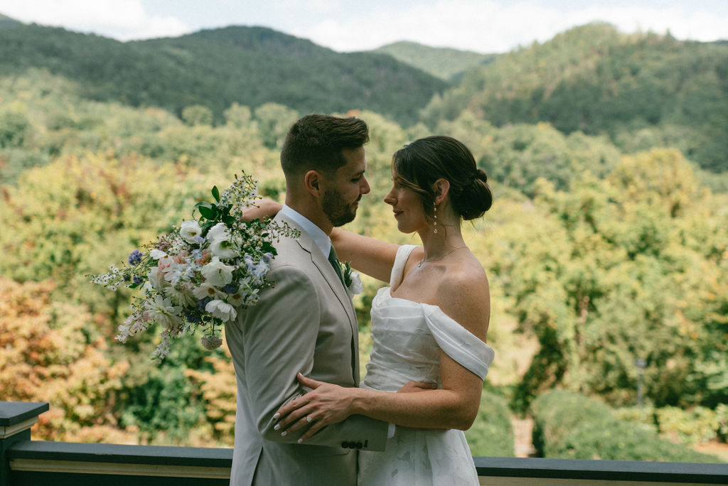 stunning couple looking at each other during their fall mountain wedding session