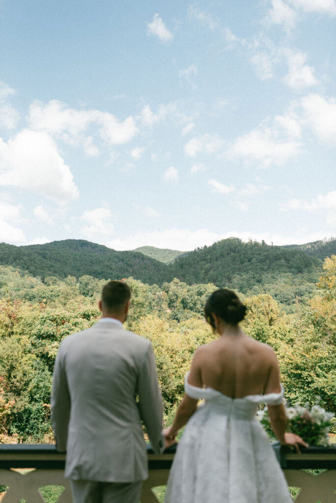 couple before their fall mountain wedding ceremony 