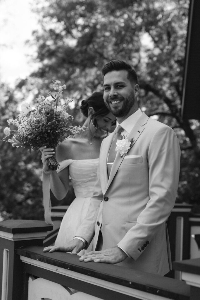 bride and groom smiling before fall wedding ceremony 
