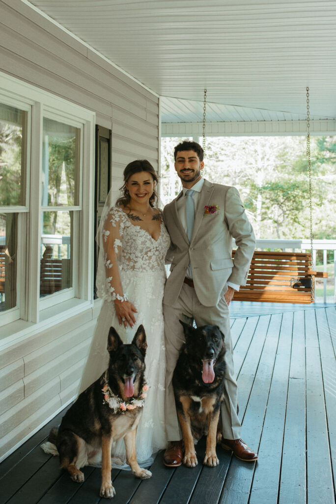 couple with their dogs at their intimate backyard wedding 