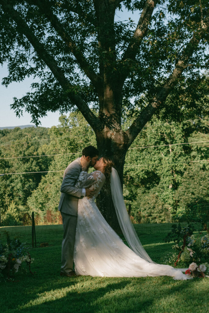 bride and groom kissing after their ceremony 