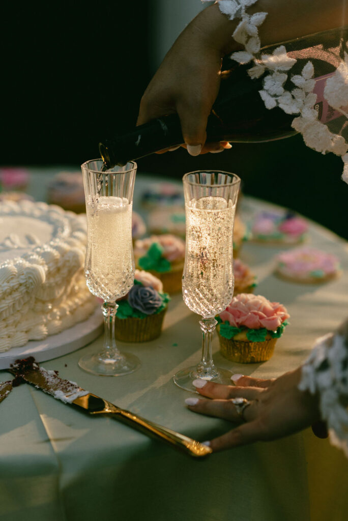 couple eating cake and drinking champagne