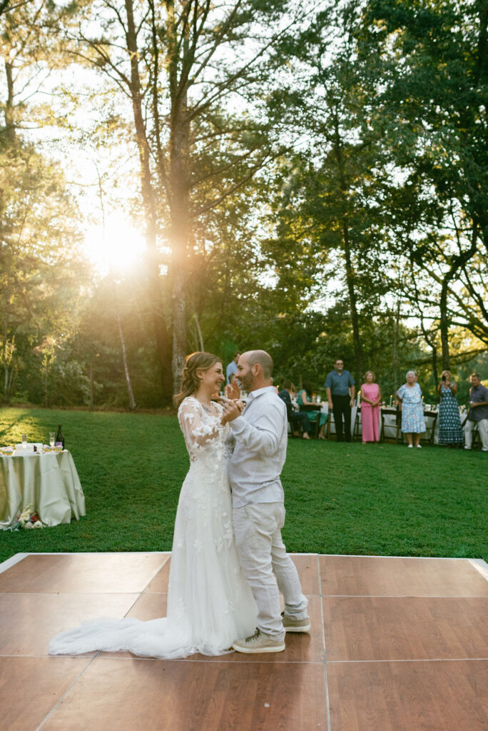 bride dancing with her dad at her intimate backyard wedding