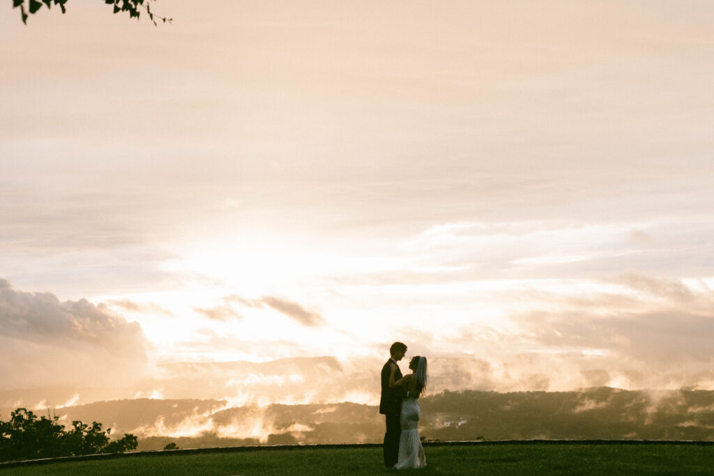 Bride & Groom dancing in the sunset at North georgia Elopement with Mountains in the background