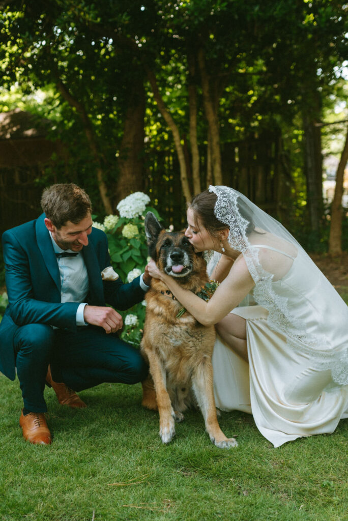 portrait of the newly married couple with their dog