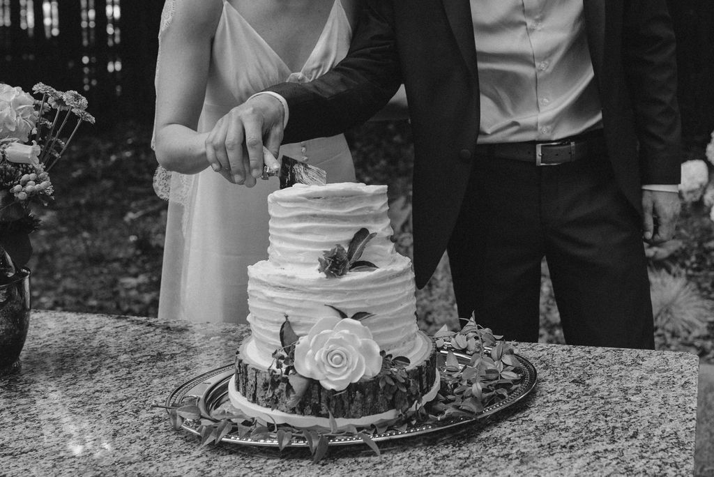 bride and groom cutting their wedding cake italian garden wedding 