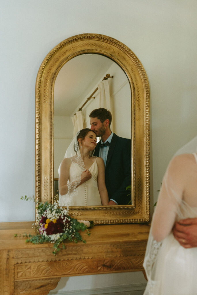 bride and groom looking in a mirror - italian garden wedding 