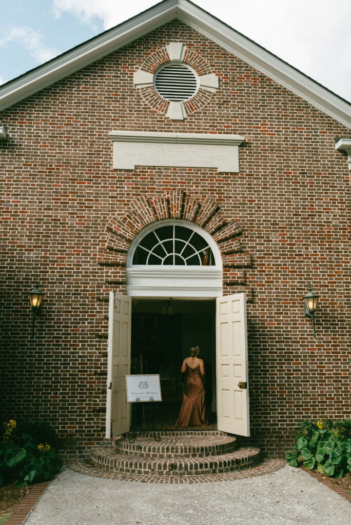 wedding guests entering the chapel