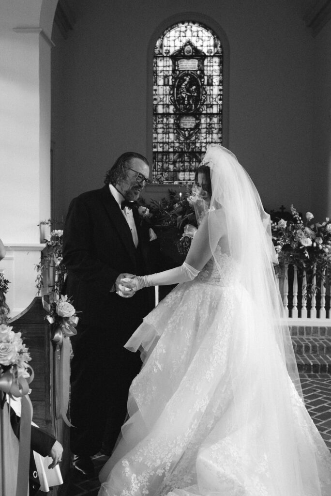 bride laughing with her dad after the wedding ceremony