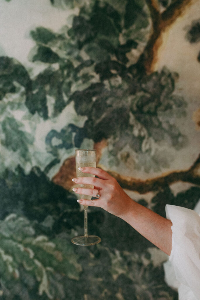 bride holding a glass of champagne 