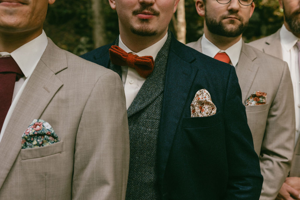 close up shot of the groom and groomsmen at the ethereal wedding day
