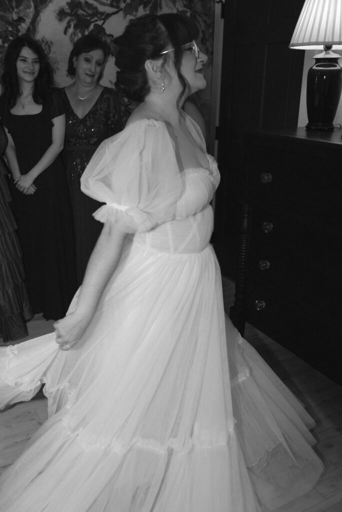 bride dancing in her wedding dress before her ethereal wedding day ceremony 