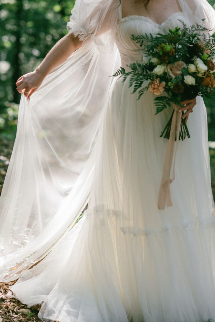 closeup shot of the brides wedding dress