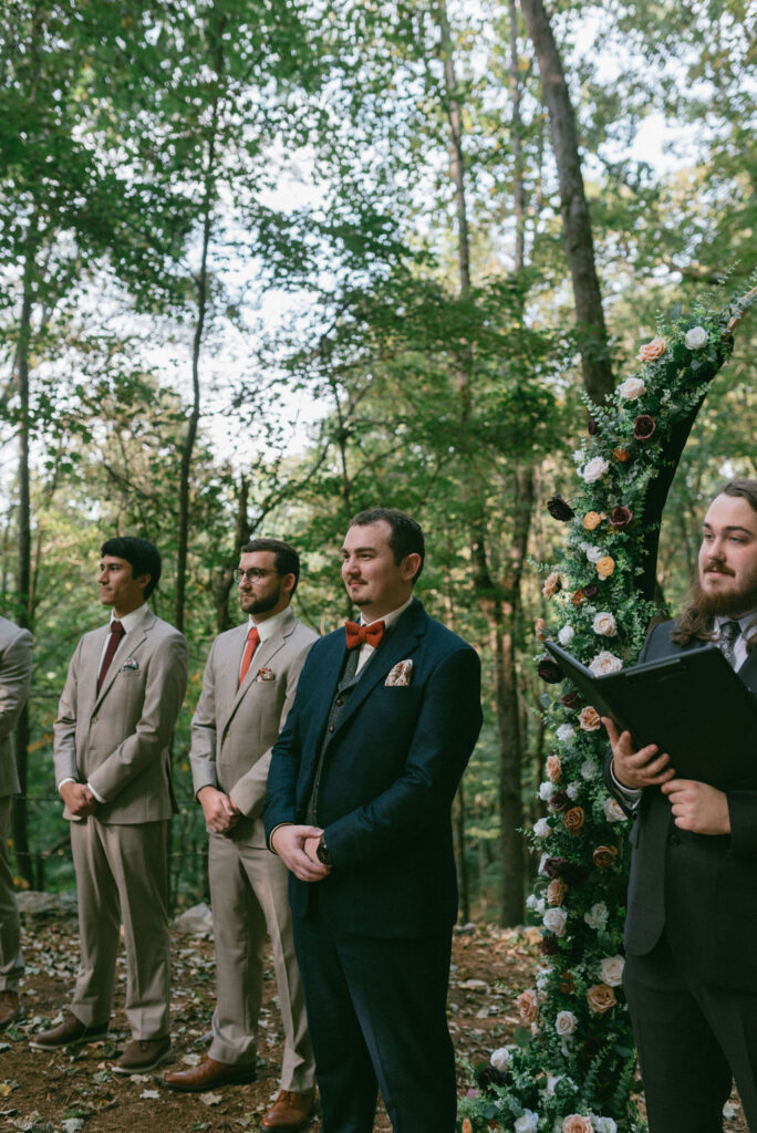 groom and groomsmen at the altar