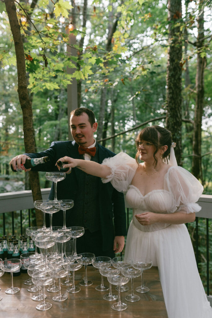 bride and groom with their champagne tower