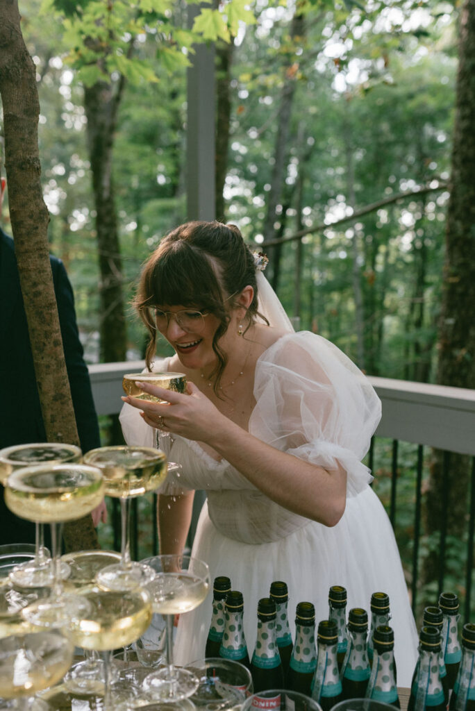 bride drinking champagne at her ethereal wedding day reception
