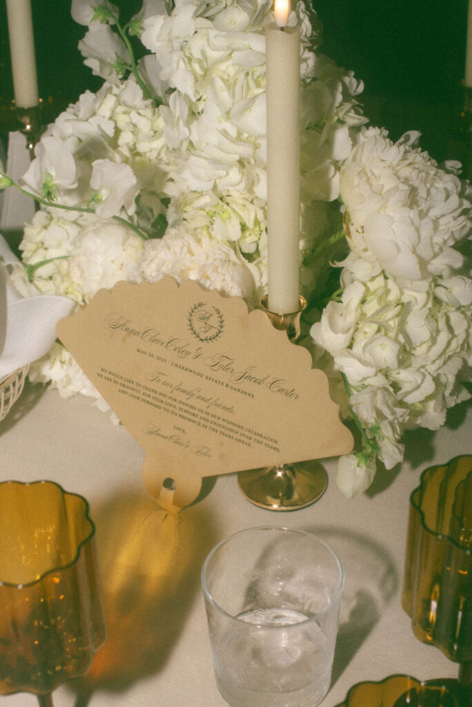 Reception at Cheekwood Estate String Lights with olive green tablecloths and hydrangeas on the tables