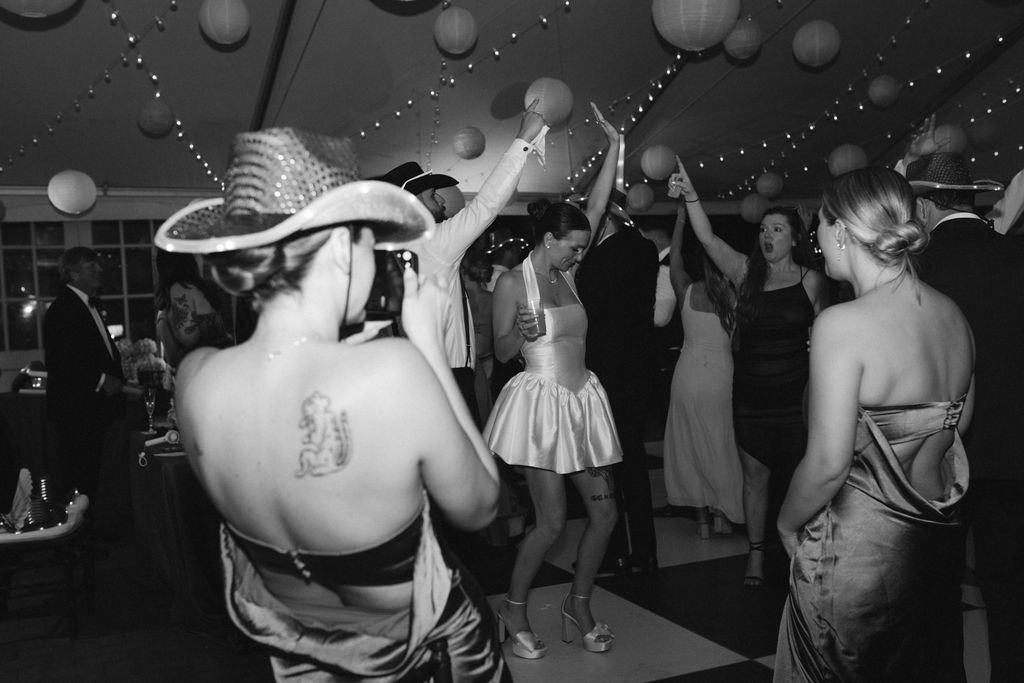 Reception at Cheekwood Estate with checkered dance floor. Bride & groom dancing 