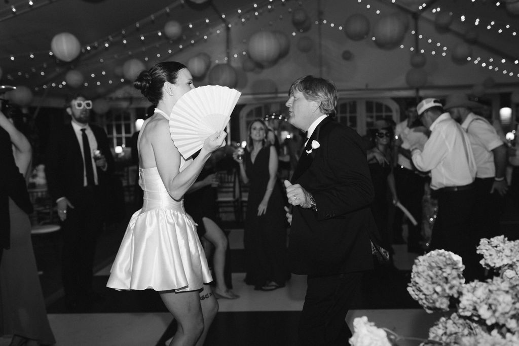 Reception at Cheekwood Estate with checkered dance floor. Bride & dad dancing 