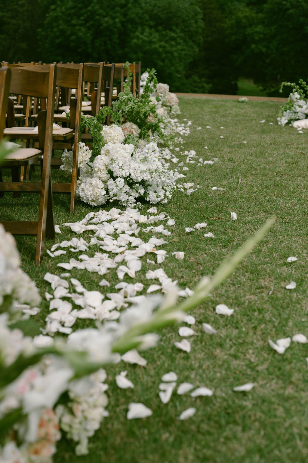 Wedding Aisle decorated with white hydrangeas and rose petals at Cheekwood Estate 
