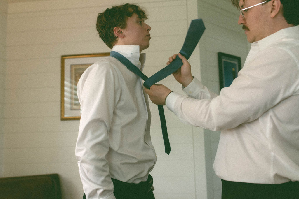 Groom and best man getting ready