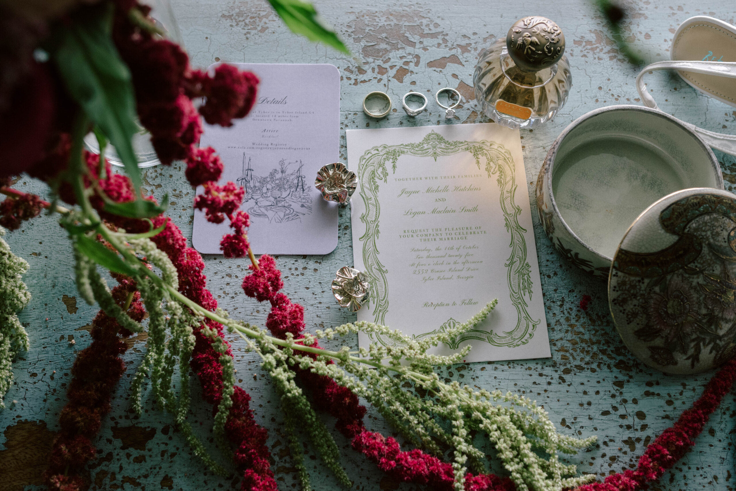 wedding details earrings perfume rings and invitations