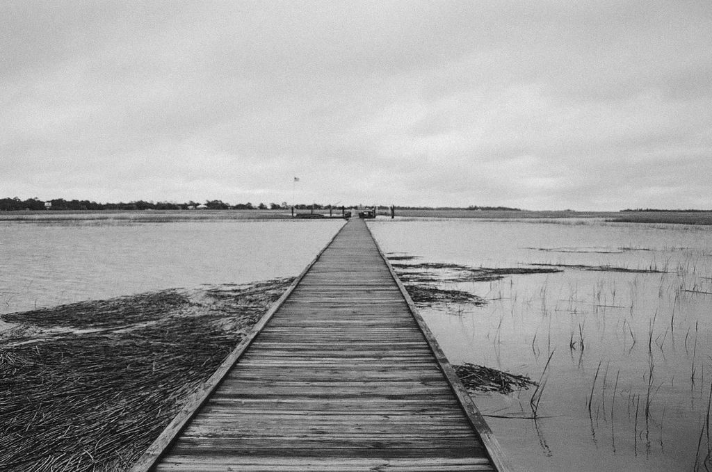 35 mm black and white film photo of dock over marsh on tybee island