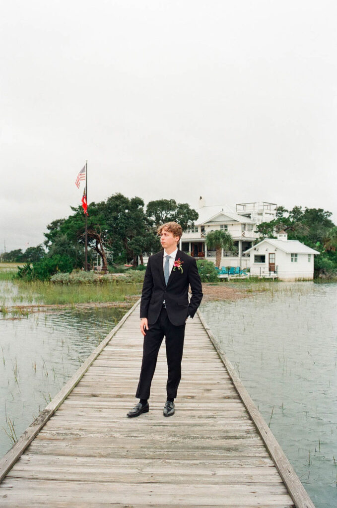 35 mm film photo of groom on dock at The Venue on Tybee