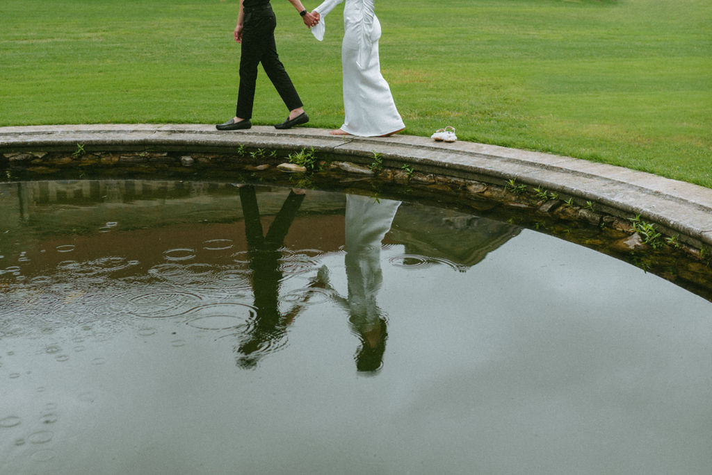 couple walking around a fountain