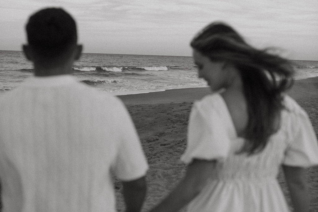 couple walking around tybee island