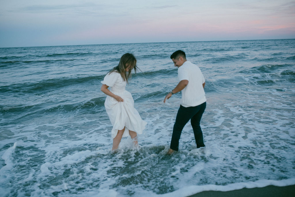 couple at the stunning tybee island at their cozy beach engagement session 