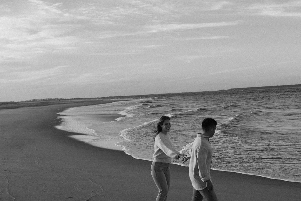 couple walking on the beach 