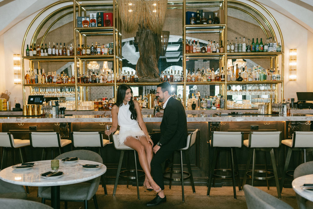 couple at the bar during their photoshoot