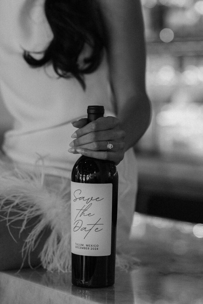 bride holding a champagne bottle during her engagement photoshoot 
