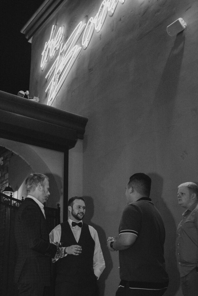 groom talking with the wedding guests 