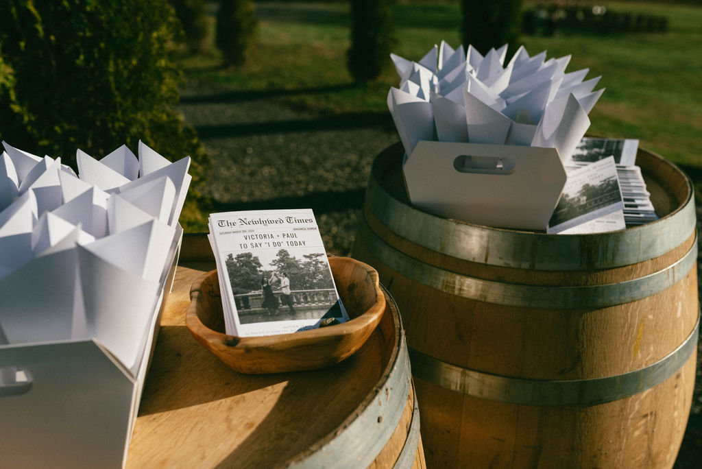 Wedding programs on wine barrel