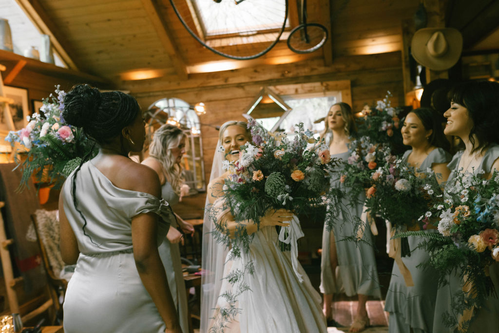 Bride and bridesmaids with flowers 